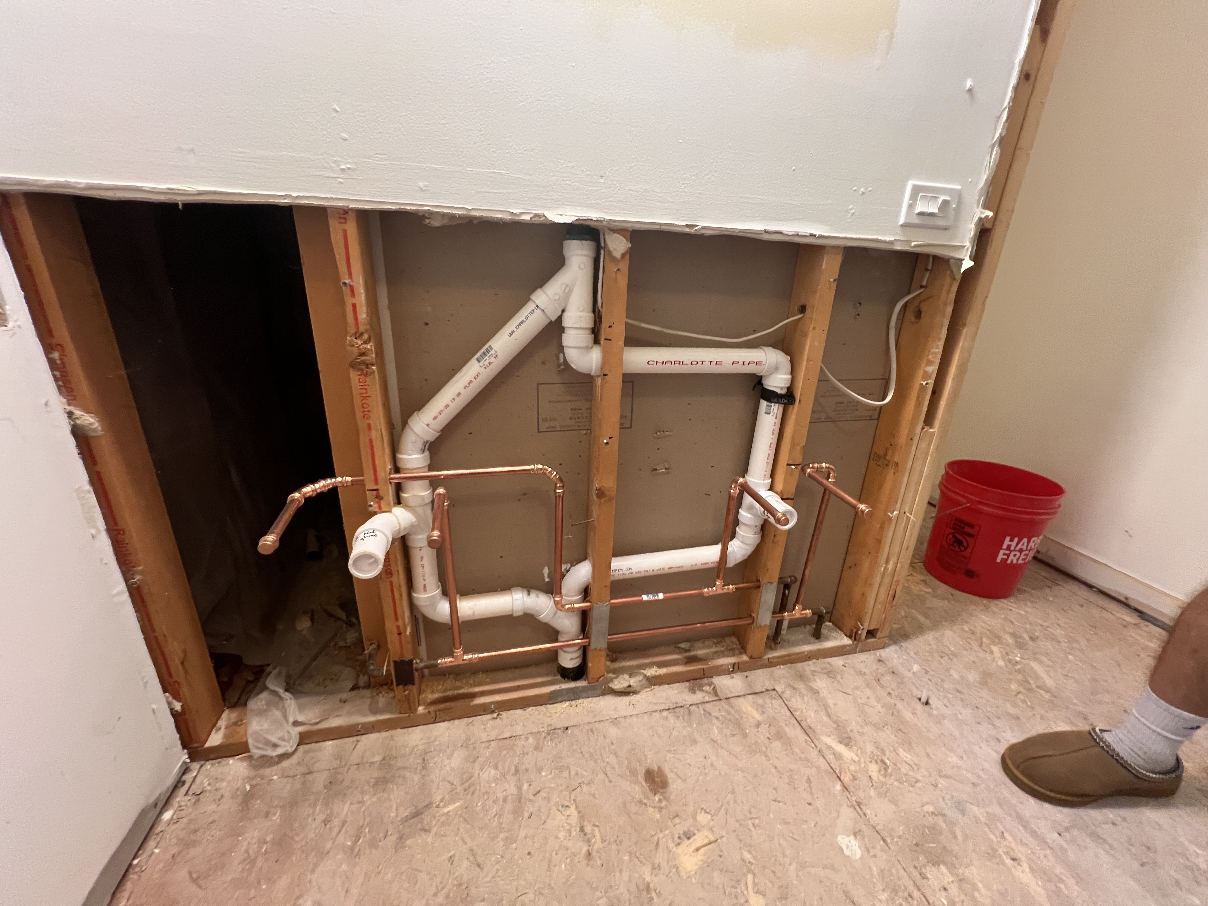 Rough-in plumbing in wall cavity by Ward and Sons Plumbing