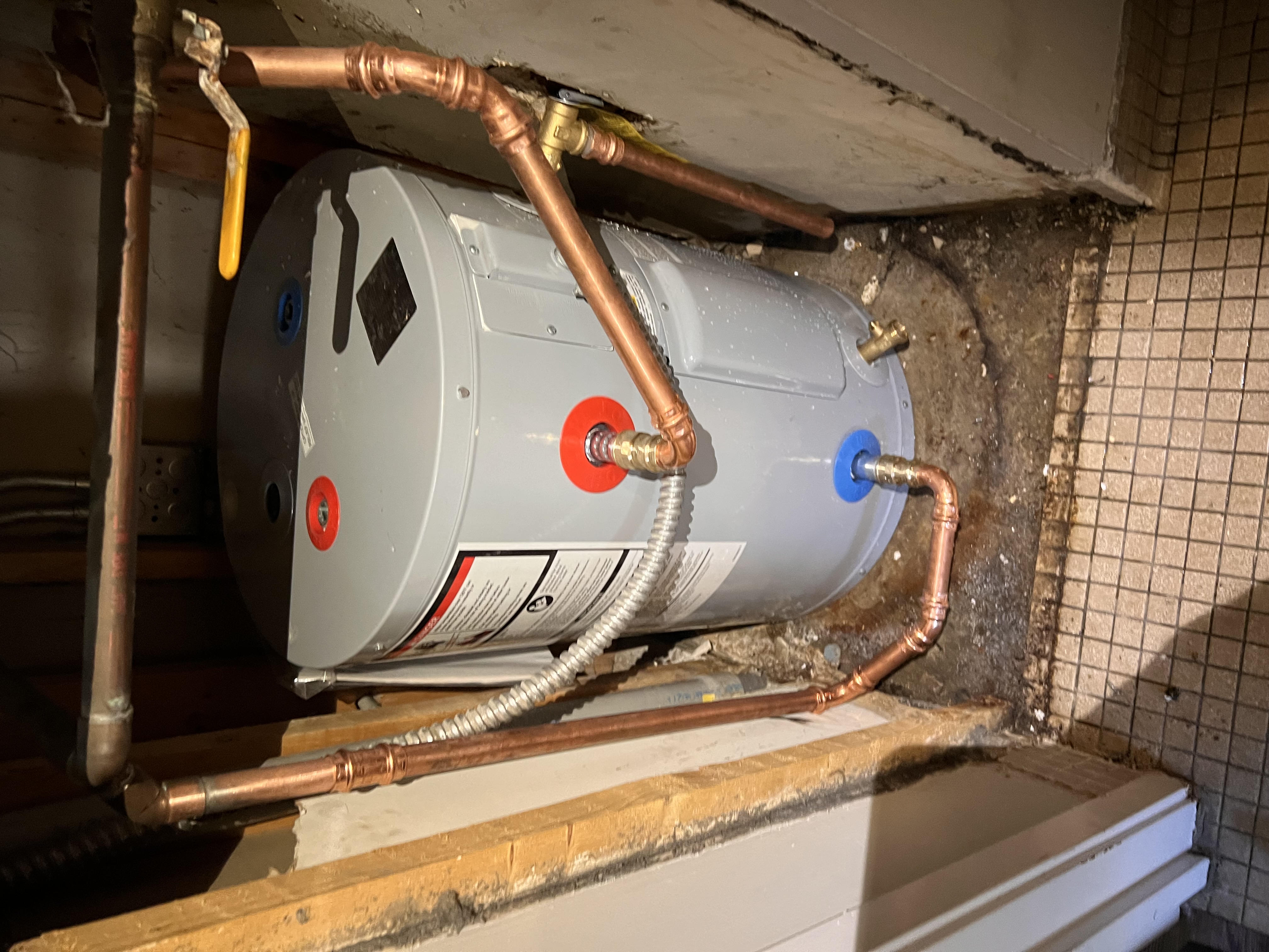 Tank water heater installation by Ward and Sons Plumbing